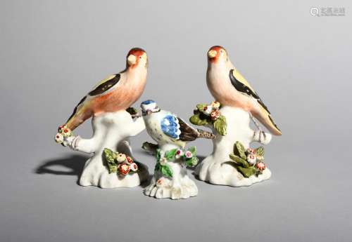A small Derby model of a blue tit, c.1765-75, perched on a stump applied with flowers and leaves,