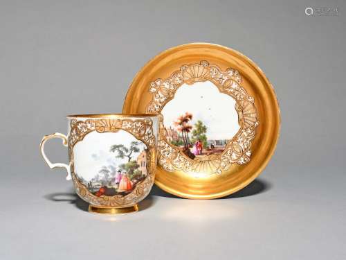 A Meissen cup and saucer, c.1740, finely painted with panels of figures standing and on horseback
