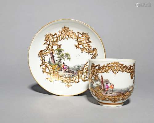 A Meissen cup and saucer, c.1740, painted with scenes of travellers meeting on the road and