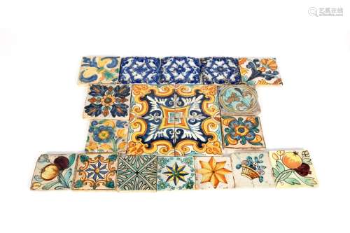 A group of twenty Spanish maiolica tiles, 18th/19th century, including four with formal foliate