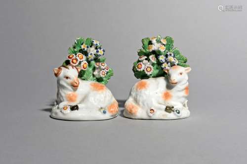 A small pair of Derby figures of sheep, c.1760-70, depicting a ewe and a ram each recumbent before