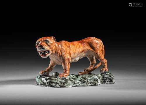 An extremely rare Bow figure of a prowling lioness, c.1750-52, of large size, standing on a rocky
