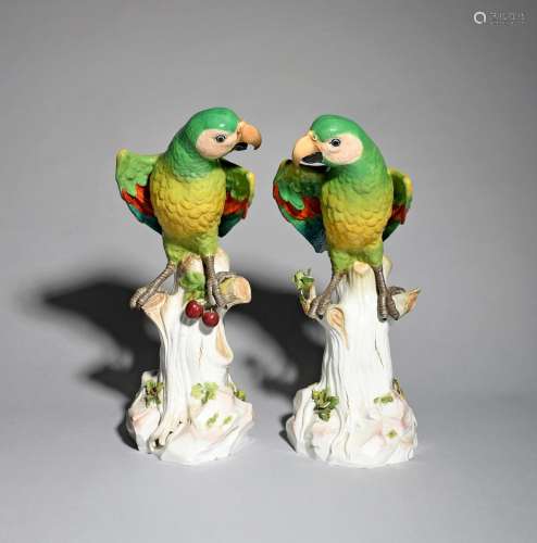 A very large pair of Meissen figures of parrots, 19th century, brightly decorated with colourful