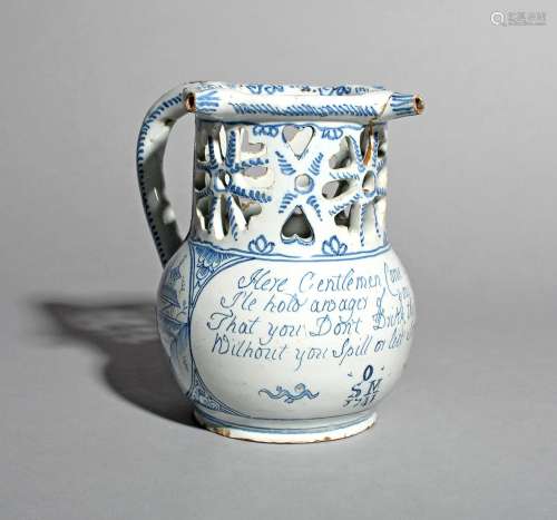 A rare delftware puzzle jug, dated 1741, the globular body inscribed with the traditional four