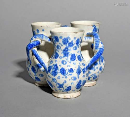A London delftware fuddling cup, c.1710, formed of three thistle-shaped cups joined by