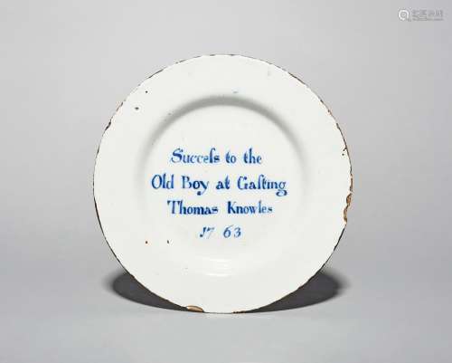 A documentary delftware plate, dated 1763, possibly Liverpool, the well inscribed in blue with '