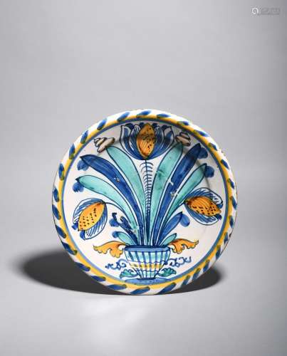 A delftware blue dash tulip charger, c.1680, probably Brislington, boldly painted with three