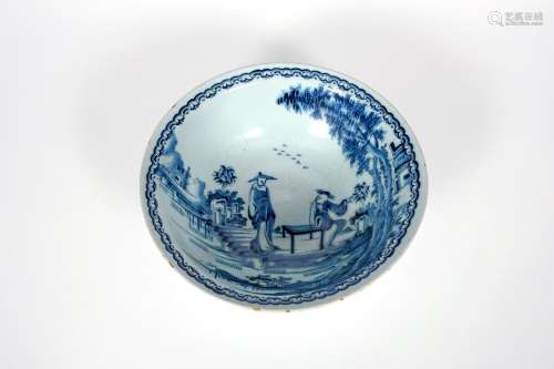 A delftware wash basin, c.1750-70, with an everted rim, painted in blue with two Chinese figures