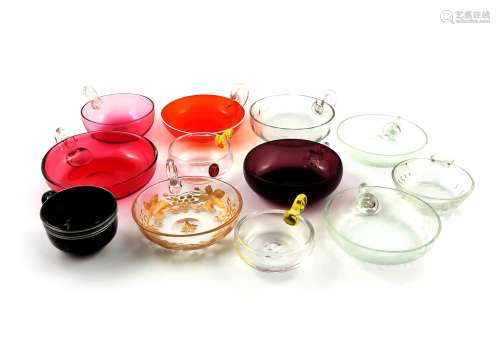 Twelve glass wine tasters, 19th and 20th centuries, most of shallow circular form, two engraved with