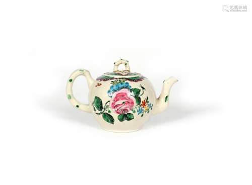 A Staffordshire salt-glazed teapot and cover, c.1760, the globular body painted in bright enamels