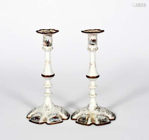 A small pair of Staffordshire enamel candlesticks, c.1770, the hexagonal feet printed and coloured