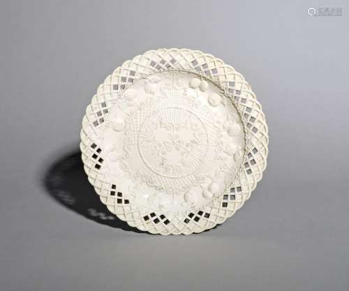 A salt-glazed stoneware plate, c.1770, the well moulded with short fruit branches around an