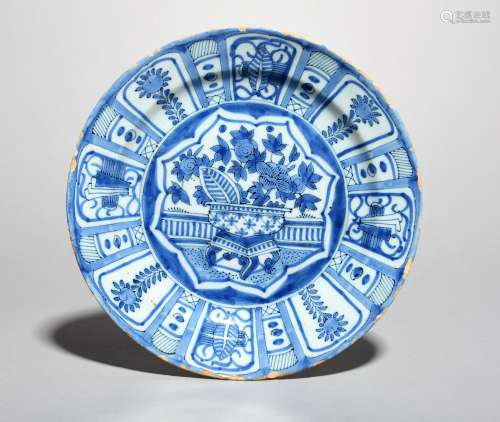 A Delft plate, late 17th century, painted in the Kraak manner with a censer of flowering plants