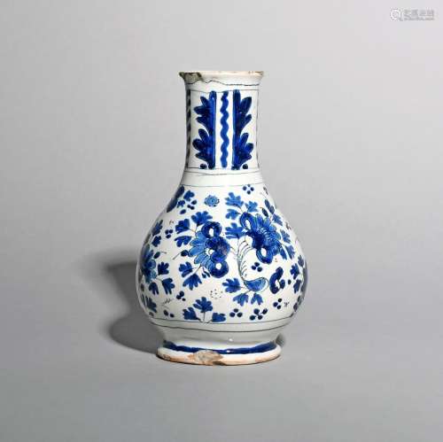 A London delftware bottle or vase, c.1700-20, painted in blue and black with a dense floral