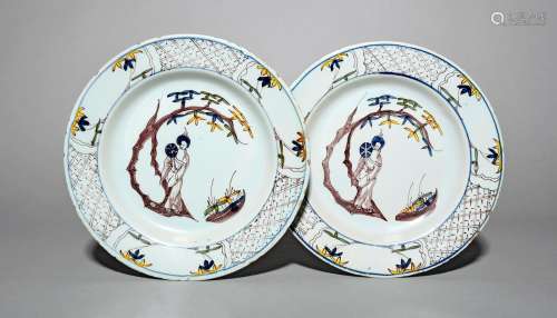 A pair of Lambeth delftware plates, c.1750-60, each painted with a Chinese lady holding a fan and