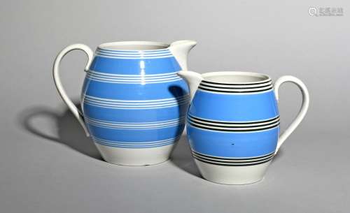 Two large pearlware jugs, 19th century, of Mocha ware type, the barrel-shaped bodies decorated