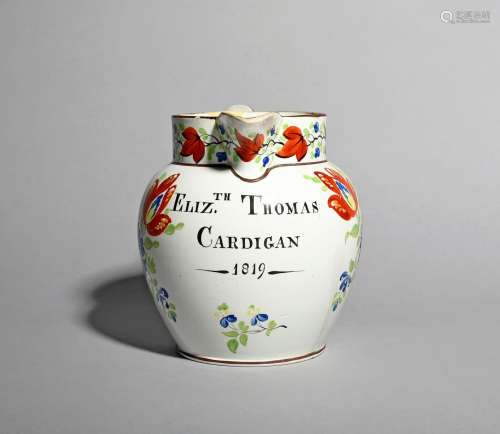 A pearlware jug, dated 1819, probably Swansea, boldly painted with Gaudy Welsh type flower sprays,