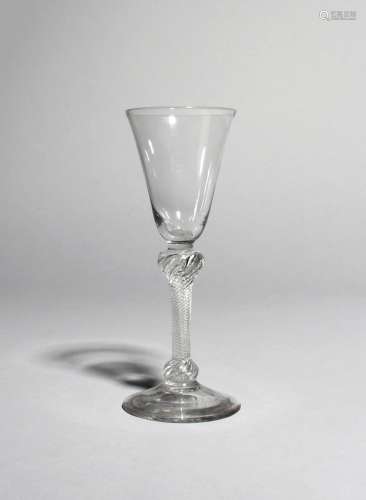 A wine glass, c.1760-70, with a rounded funnel bowl raised on an airtwist stem knopped at the