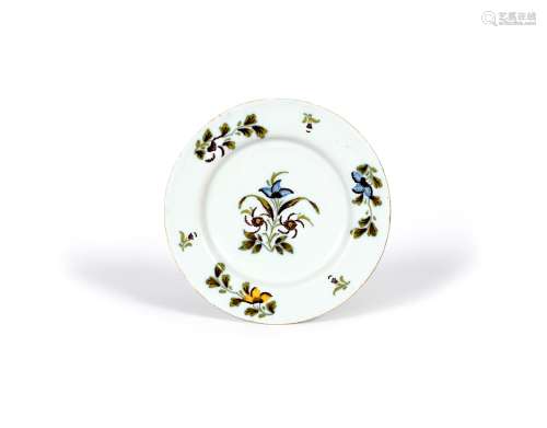 An Irish delftware plate, c.1760, probably Dublin, painted with flower sprays in shades of yellow,