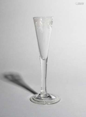 A ratafia glass, c.1750-60, with a slender drawn trumpet bowl engraved with a continuous band of