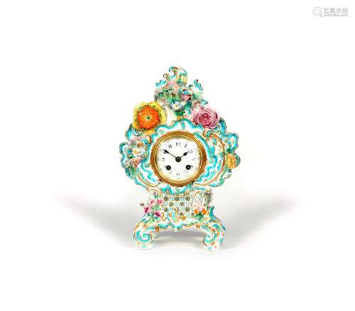 A Coalport cased clock, c.1840-50, of elaborate rococo scrolled form, applied with colourful flowers