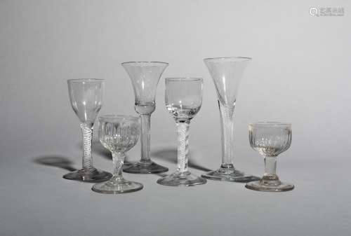 Four wine glasses, c.1760-70, two with rounded funnel bowls raised on multi series opaque twist