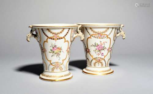 A pair of English porcelain vases, 19th century, of generous flared form, painted with flower sprays