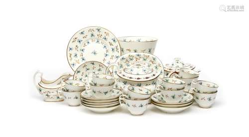 An English porcelain part tea service, c.1810, painted in pattern 155 with small blue flower