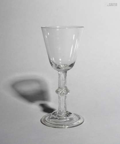 A large wine glass or goblet, c.1760, with a generous rounded funnel bowl raised on a knopped