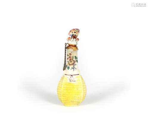 A Chelsea scent bottle, c.1755, modelled as a bottle contained in a yellow wicker basket, the neck
