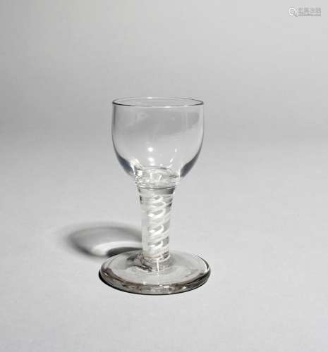 A firing or dram glass, c.1760, with a rounded funnel bowl raised on a double series opaque twist