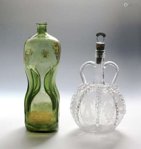 A Union decanter, c.1820, the tall pinched-waist form of a pale green metal, inscribed in gilt