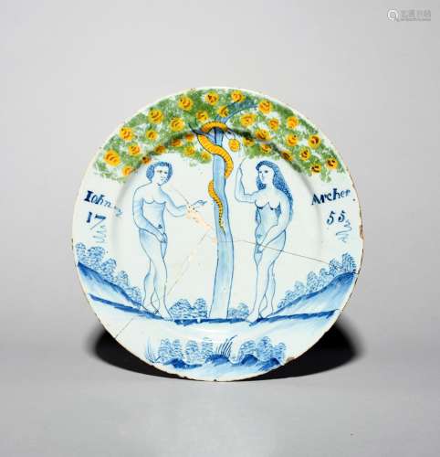 A rare Bristol delftware documentary Adam and Eve charger, dated 1755, the first couple depicted