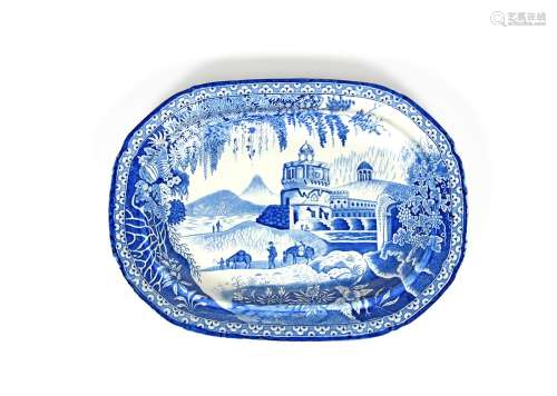 A blue and white transferware charger, 19th century, the oblong form printed with figures trekking