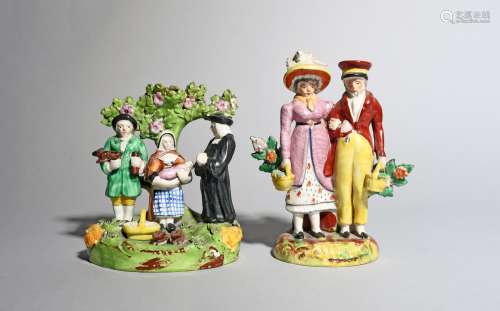 A Staffordshire Tithe Pig figure group, 19th century, modelled with the farmer and his wife offering