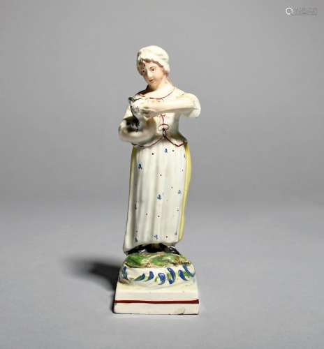 A Staffordshire pearlware figure of a girl, c.1800-10, possibly Neale & Co, standing and holding a