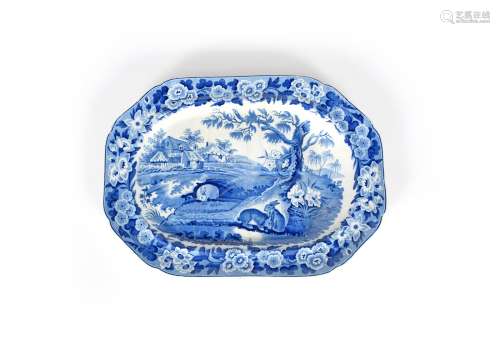 A blue and white transferware meat dish, 19th century, moulded with draining channels, printed