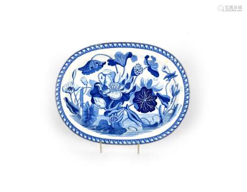 A Wedgwood blue and white transferware charger, c.1810, boldly decorated with the botanical
