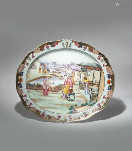 A LARGE CHINESE MANDARIN PALETTE OVAL DISH LATE 18TH CENTURY Painted with a lady and a boy in a