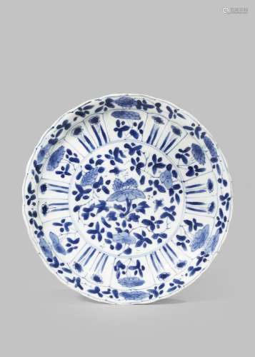 A CHINESE BLUE AND WHITE MOULDED DISH KANGXI 1662-1722 Painted to the centre with floral sprays