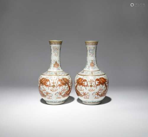 A PAIR OF CHINESE FAMILLE ROSE 'DRAGON' BOTTLE VASES 19TH CENTURY Each decorated with two large
