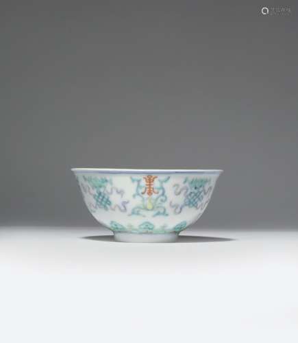 A CHINESE DOUCAI 'BUDDHIST EMBLEMS' BOWL 20TH CENTURY The U-shaped body raised on a tapering foot