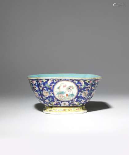 A CHINESE FAMILLE ROSE BLUE-GROUND QUATRELOBED BOWL 19TH CENTURY Painted with four roundels