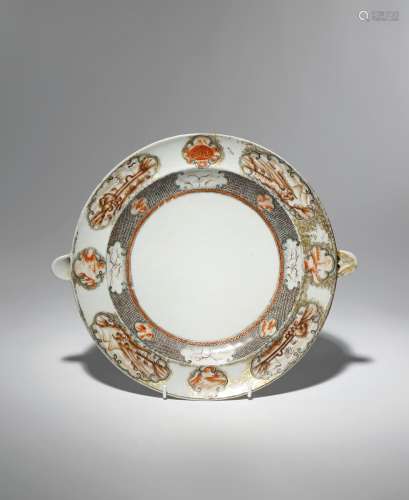 A CHINESE ROUGE-DE-FER WARMING DISH 18TH CENTURY The border decorated with panels enclosing