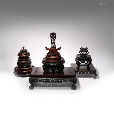 A SMALL COLLECTION OF CHINESE WOOD STANDS AND COVERS 19TH AND 20TH CENTURY Comprising: twelve stands
