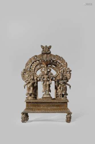 AN INDIAN COPPER BUDDHIST GROUP 16TH/17TH CENTURY The central figure of Shakyamuni flanked by two