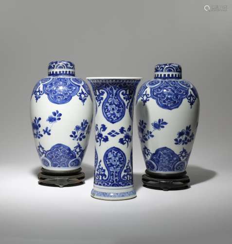 A PAIR OF CHINESE BLUE AND WHITE OVOID VASES AND A BEAKER VASE KANGXI 1662-1722 Decorated with