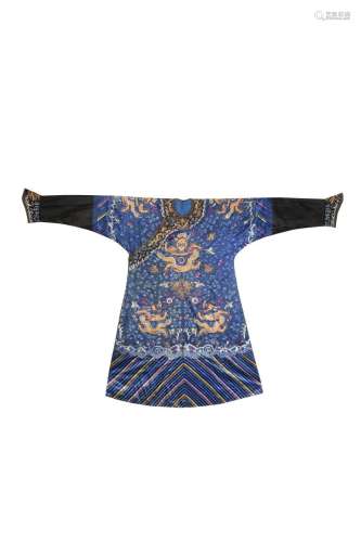 A CHINESE BLUE-GROUND EMBROIDERED SILK 'NINE DRAGON' ROBE LATE QING DYNASTY The dragons picked out
