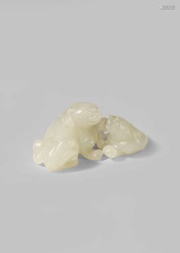 A SMALL CHINESE PALE CELADON JADE CARVING OF TWO LION DOGS QING DYNASTY OR LATER Carved as a