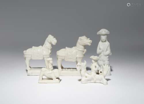 TWO CHINESE BLANC DE CHINE MODELS OF HORSES AND THREE WHISTLES KANGXI 1662-1722 The horses